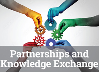Five hands, each holding a sprocket and each of a different color, hold their gears together to represent collaboration and partnership.