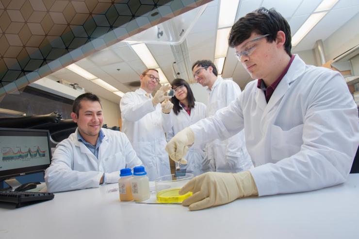 Fabrication of the microchip. The device is fabricated by injecting a polymer into a micro fabricated mold and the polymer is cured under ultraviolet light to produce low-cost, single-use devices.
