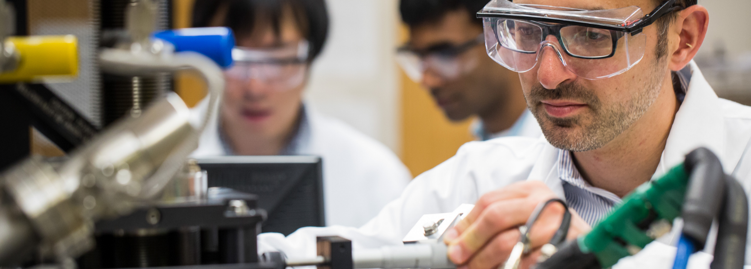 scientist working with microscope