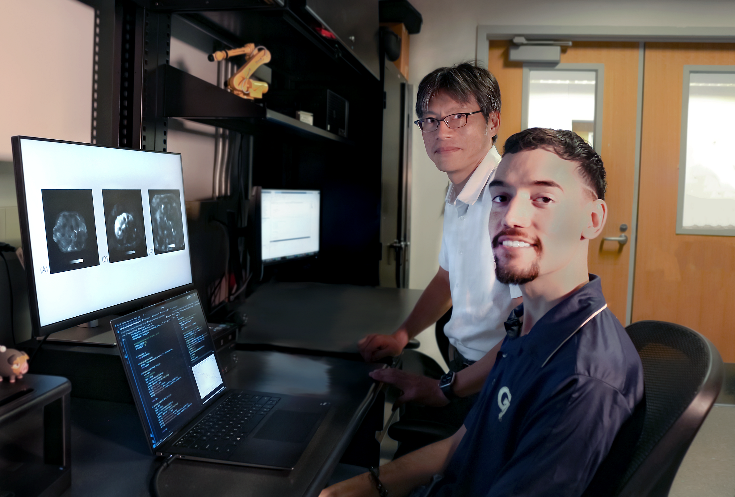  Professor Jun Ueda in the George W. Woodruff School of Mechanical Engineering and robotics Ph.D. student Heriberto Nieves.  Professor Jun Ueda in the George W. Woodruff School of Mechanical Engineering and robotics Ph.D. student Heriberto Nieves.