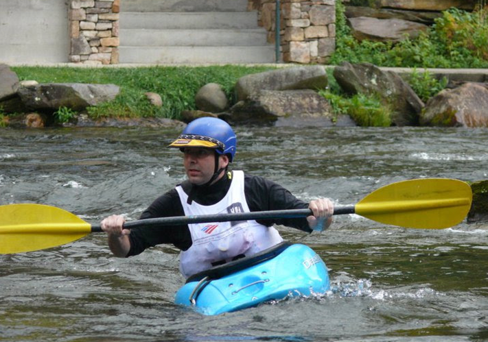 Rob Butera on a kayak white water rafting.