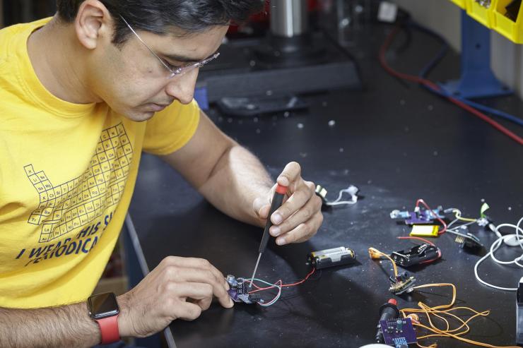 Saad Bhamla assembling hearing aid