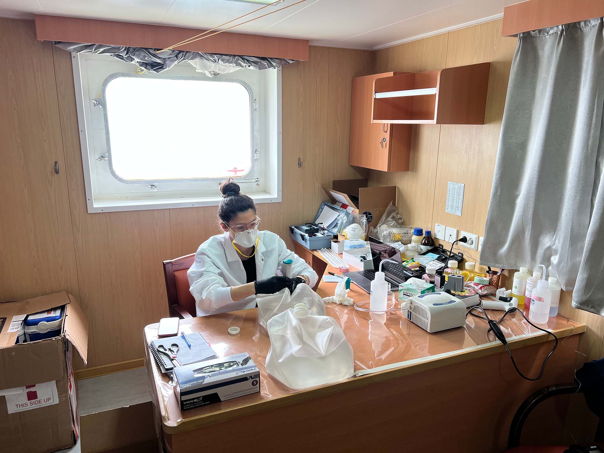 Patrisia in her cabin analyzing and labelling samples