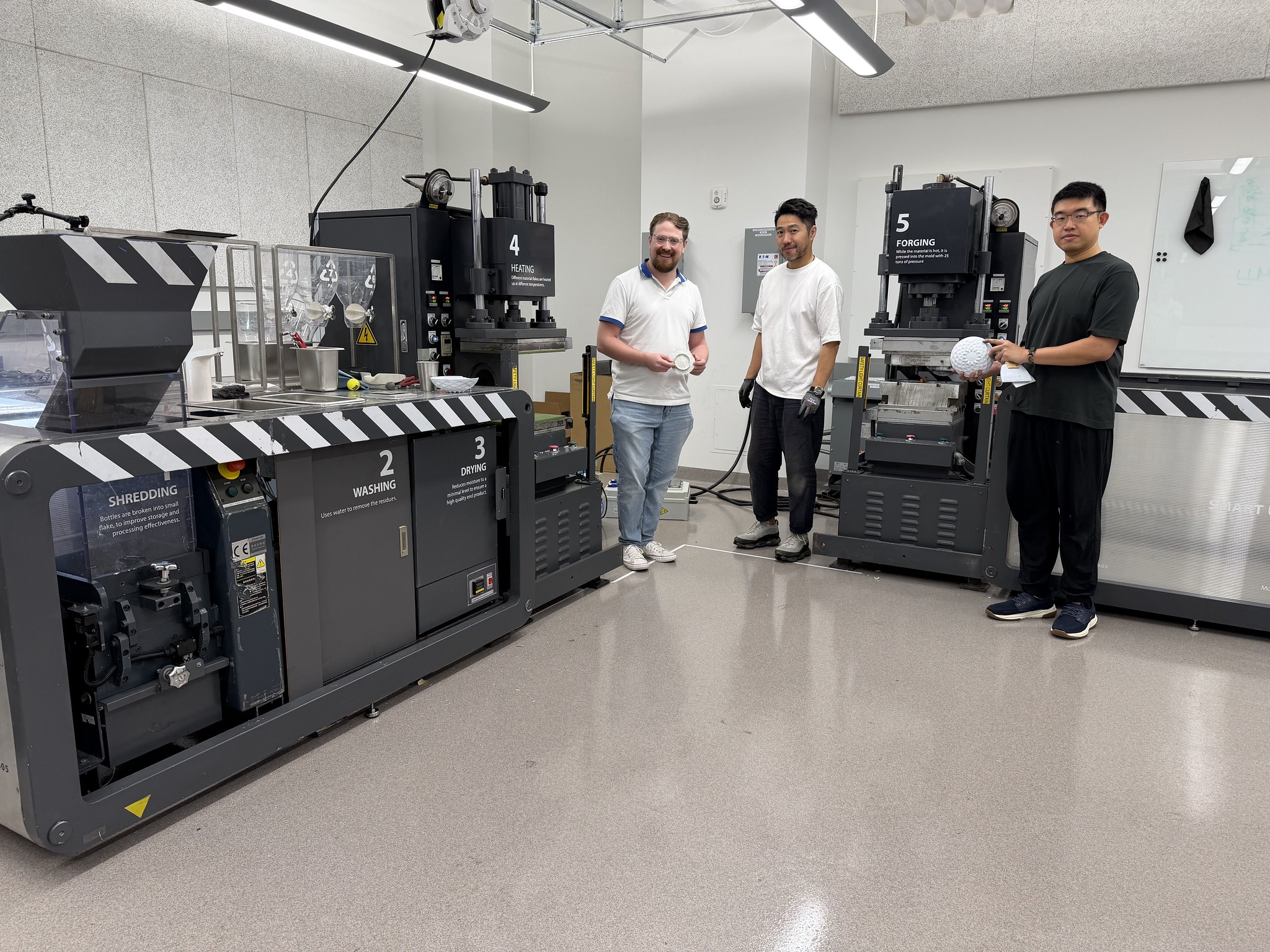 Pictured left to right: Tim Trent, IPaT’s lab director for the Trash Lab; Arthur Huang, CEO of Miniwiz; and Tai Liu, mechanical engineer with Miniwiz. In this picture, they are installing the miniTrashpresso system in the TSRB building.