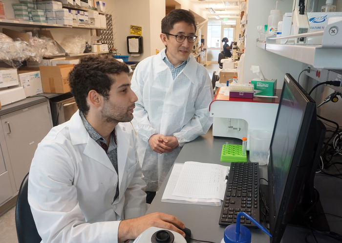 Gabe and student in lab