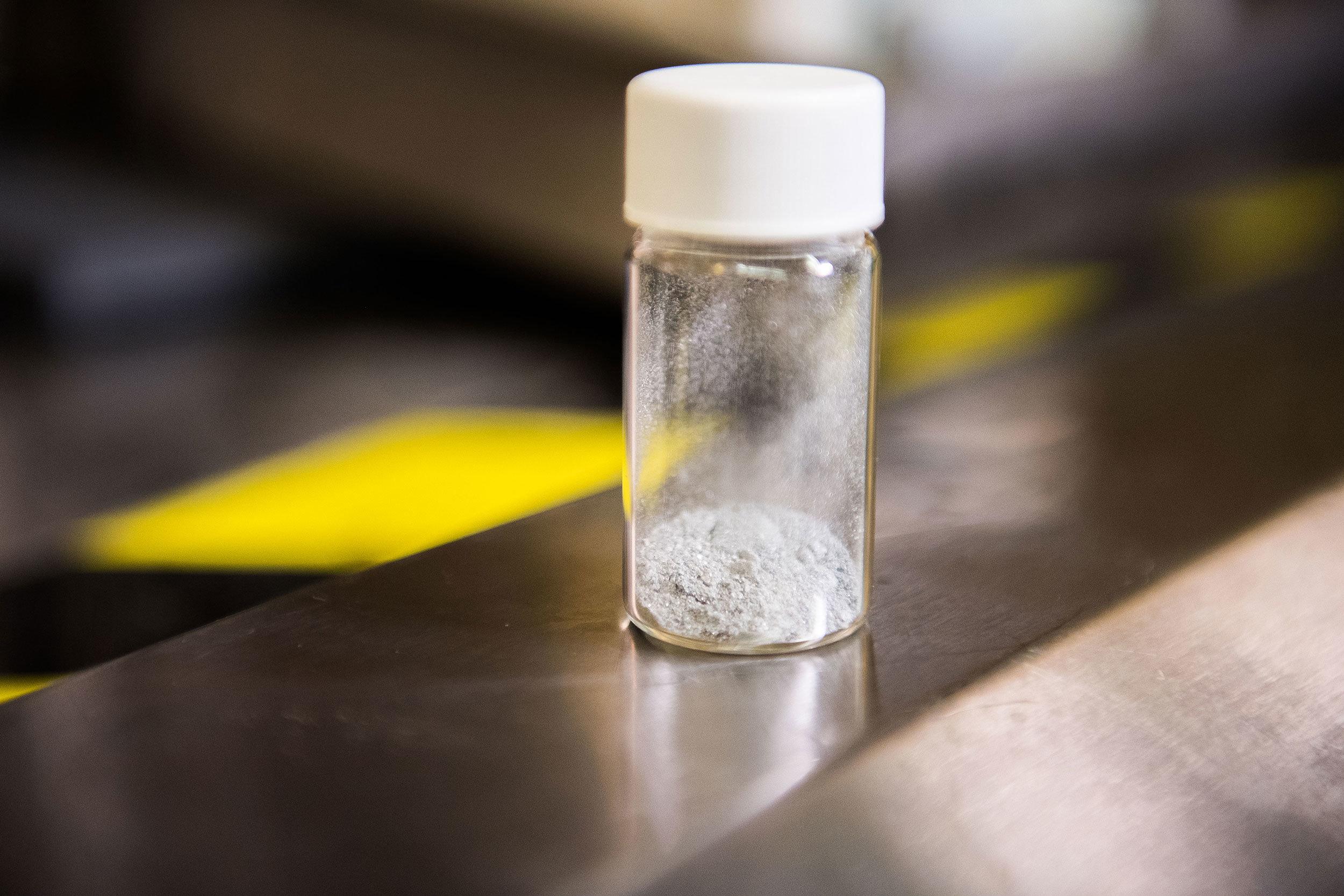 a small vial of white powder