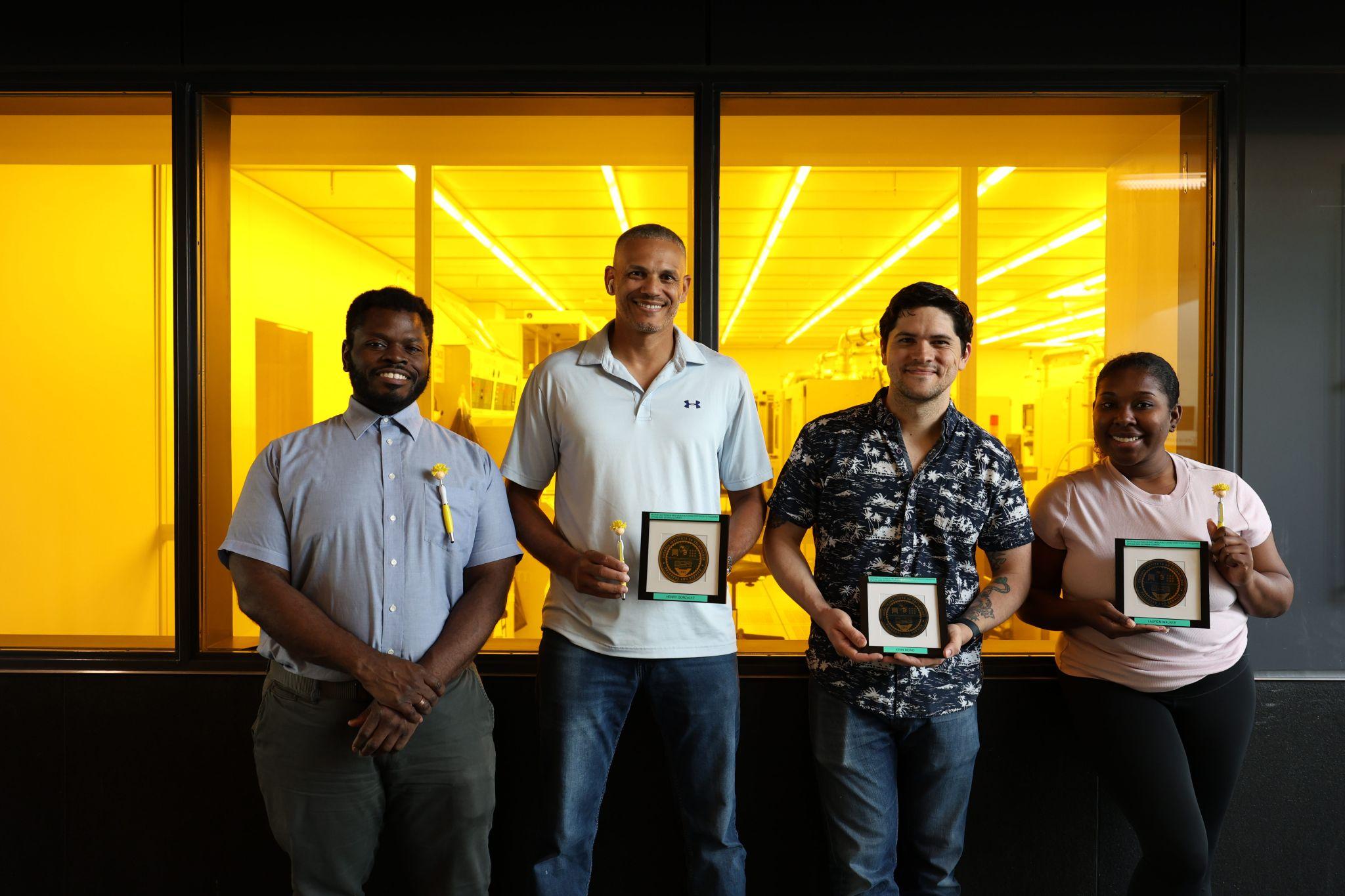 The four members of the 2025 MNCP with the wafers they made. 