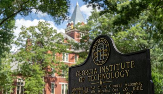 Georgia Tech's historic campus signage is shown, with Tech Tower in the background.