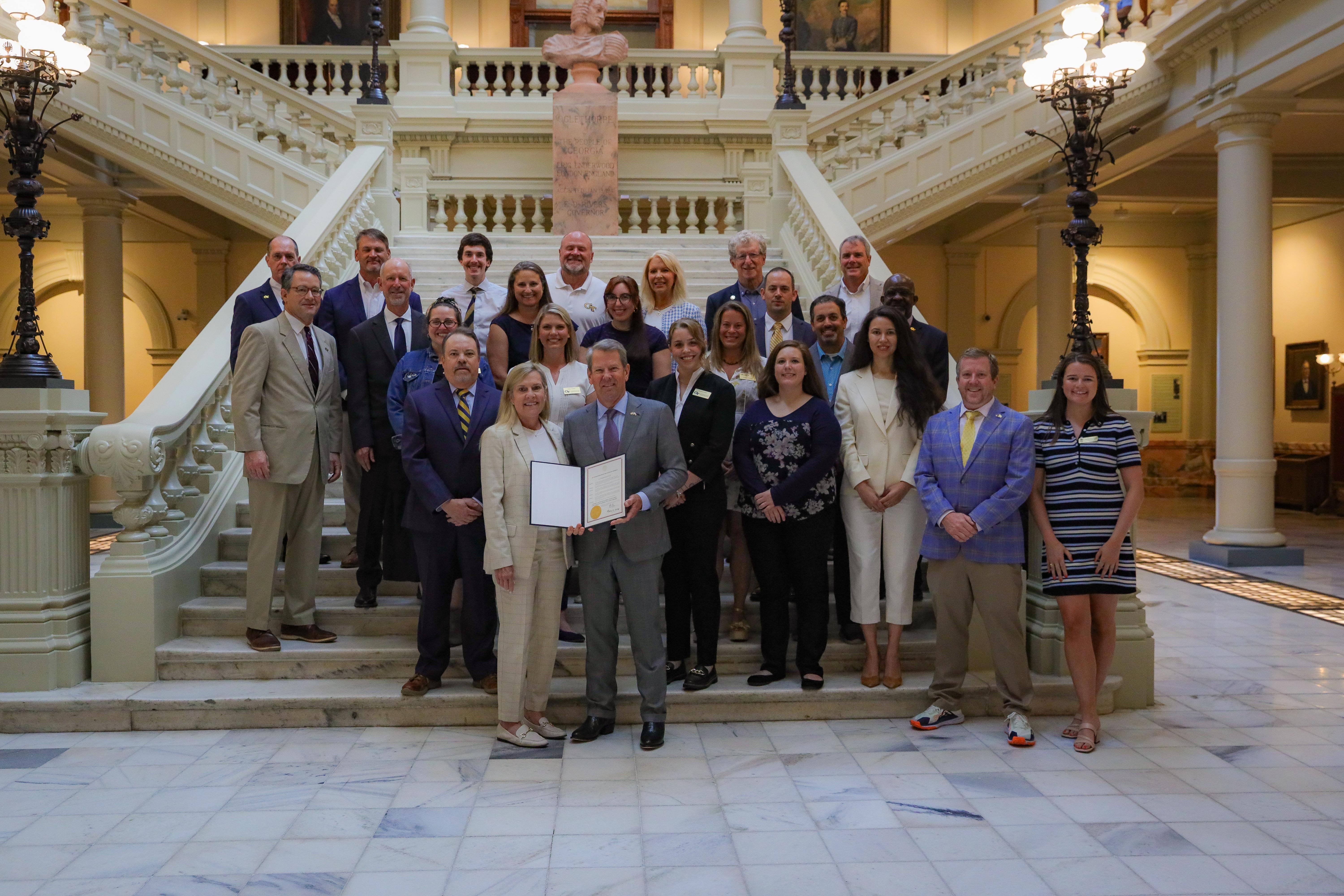 Group photo of Georgia Manufacturing Extension Partnership staff receiving a commendation from Georgia Gov. Brian Kemp.