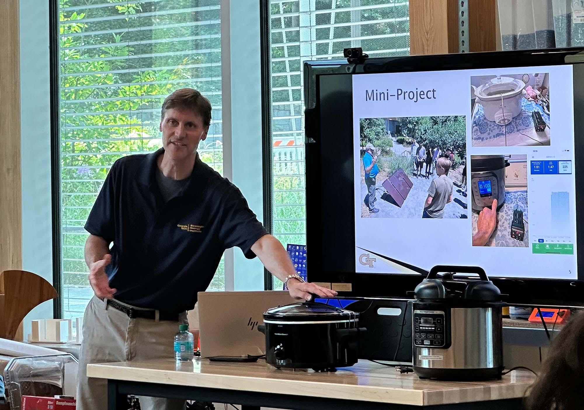 Rich Simmons explaining the mini-project before the final student presentations 