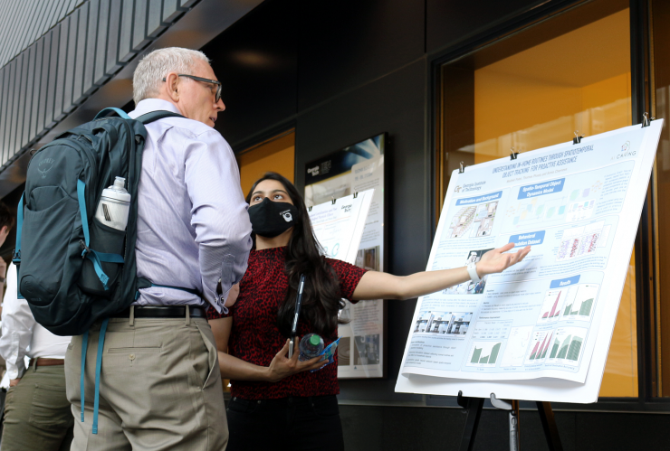 <p>Student presents a poster at IRIM’s Spring 2022 Robotics Research</p>