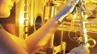 Stephanie Didas, a Georgia Tech Ph.D. candidate, loads an aminosilica sample into a custom-built volumetric adsorption system for measuring adsorption isotherms of different carbon dioxide capture materials. (Credit: Gary Meek)