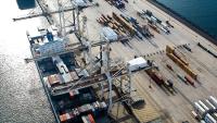 Aerial view of a shipping container sea port. This image is licensed under cc-by-2.0 by attribution. Originally posted to Flickr by Delgoff. at https://www.flickr.com/photos/94038853@N00/2256366262.