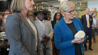 U.S. Secretary of Energy Jennifer Granholm is brought up to date by Georgia Tech's Krista Walton during a 2024 visit to campus.