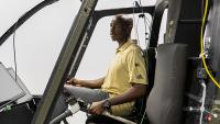 Richard Agbeyibor, flight test engineer, U.S. Air Force, sitting in a space exploration simulator.