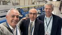 Ángel Cabrera, Cyrus Aidun, and Tim Lieuwen pose for a selfie in front of the equipment of the new Multiphase Forming Lab.