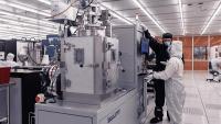 Student working with IMS staff in the fabrication cleanroom