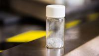 a small vial of white powder