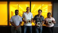 The four members of the 2025 MNCP with the wafers they made. 