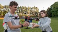<p>Catherine Heaton (right) is a fourth-year aerospace engineering major who has participated in Experimental Flights since fall 2020. Heaton said she enjoys working with a diverse group of students to solve real-world issues (Credit: Christopher Moore, GTRI).</p>