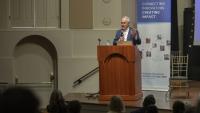 President Ángel Cabrera of Georgia Tech stands at a podium and delivers a speech.
