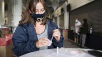 <p>A student participates in Covid-19 surveillance testing.</p>
