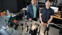 Two men stand in a lab