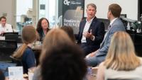 R. Shane Kimbrough speaks in front of room of people during a fireside chat