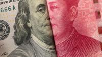America dollar and Yuan banknote with USA and China flags.