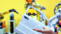 toy production into the hands of a person