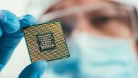 Man holding computer chip
