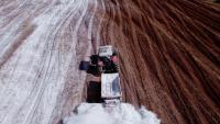 A tractor applying lime