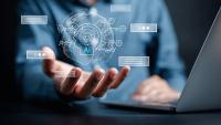 Stock Image of AI and a person holding it 