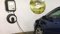 A dark blue electric car is plugged into a charger at an EV designated space in a parking structure. <a href="https://commons.wikimedia.org/wiki/File:Chevy_Volt_2nd_gen_charging_Arlington_08_2017_5216.jpg">Mariordo (Mario Roberto Durán Ortiz)</a>, <a href="https://creativecommons.org/licenses/by-sa/4.0">CC BY-SA 4.0</a>, via Wikimedia Commons