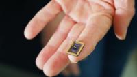 A tiny graphene device on a silicon carbide substrate chip. The device rests on a person's fingertip. Credit: Jess Hunt-Ralston, Georgia Tech 