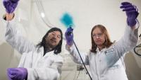 Senior Research Scientist Eric Shen (left) and Principal Research Scientist Anna Österholm (right) demonstrate how films of electrochromic polymers can be applied to large surfaces.