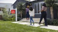 Buyers walking into house