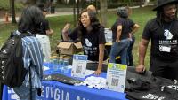 Georgia AIM representatives talk with students on Georgia Tech's campus during the launch event for their new mobile labs.