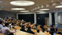 Andrew Dugenske, a principal research engineer at GTMI and symposium organizer, delivering a talk at the symposium's tenth annual gathering.