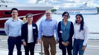<p>Carson Meredith standing outside in Finland with Georgia Tech Ph.D. students: Yue Ji (ChBE), Li Zhang (MSE), Nasreen Khan (ChBE), and Udita Ringania (ChBE).</p>