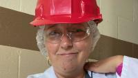 a photo of a woman, Hilarie Warren, in safety testing gear