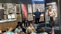 Doll giving a tour of the Robert C. Williams Museum of Papermaking to K-12 Ssudents