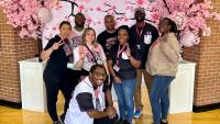 Group of people posing at competition.