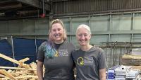 Georgia Tech intern Morgan Hale and Lifecyle Building Center Executive Director Shannon Goodman stand in a warehouse.