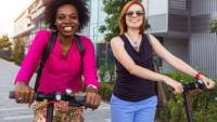 Two women on scooters