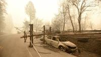 The utility Pacific Gas & Electric acknowledged responsibility for equipment that started the deadly 2018 blaze that burned through Paradise, Calif. Josh Edelson/AFP via Getty Images