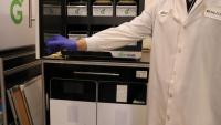 TipCycle project manager Adam Fallah demonstrates how Grenova's pipette tip washing system operates.