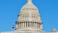Picture of the US Capitol Building dome with a clear blue sky background.