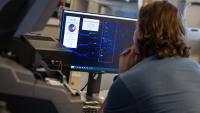 Ph.D. student Kirby Fibben uses the iCLOTS software to analyze an image of a microfluidics chip. (Photo: Candler Hobbs)