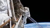 <p>Astronaut Luca Parmitano is pictured tethered to the International Space Station while finalizing thermal repairs on the Alpha Magnetic Spectrometer.</p>